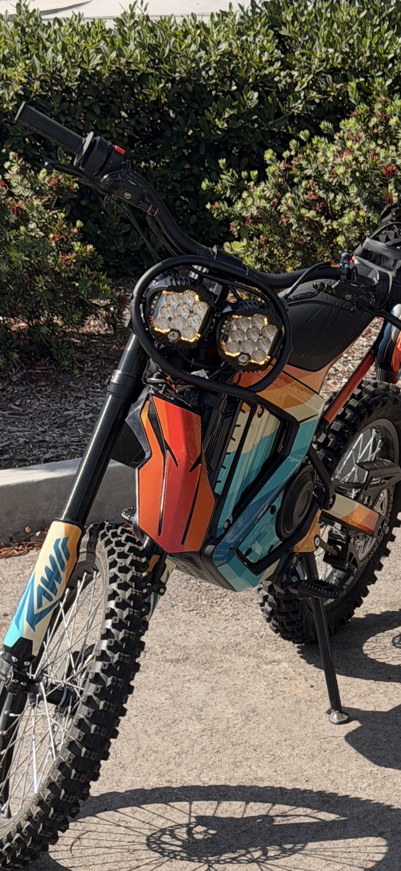 Outlaw Dual-Beam Light Kit installed on an e-bike, both LED pods illuminated